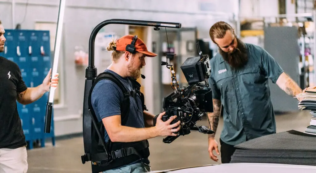 jv studios crew member filming a seadek employee