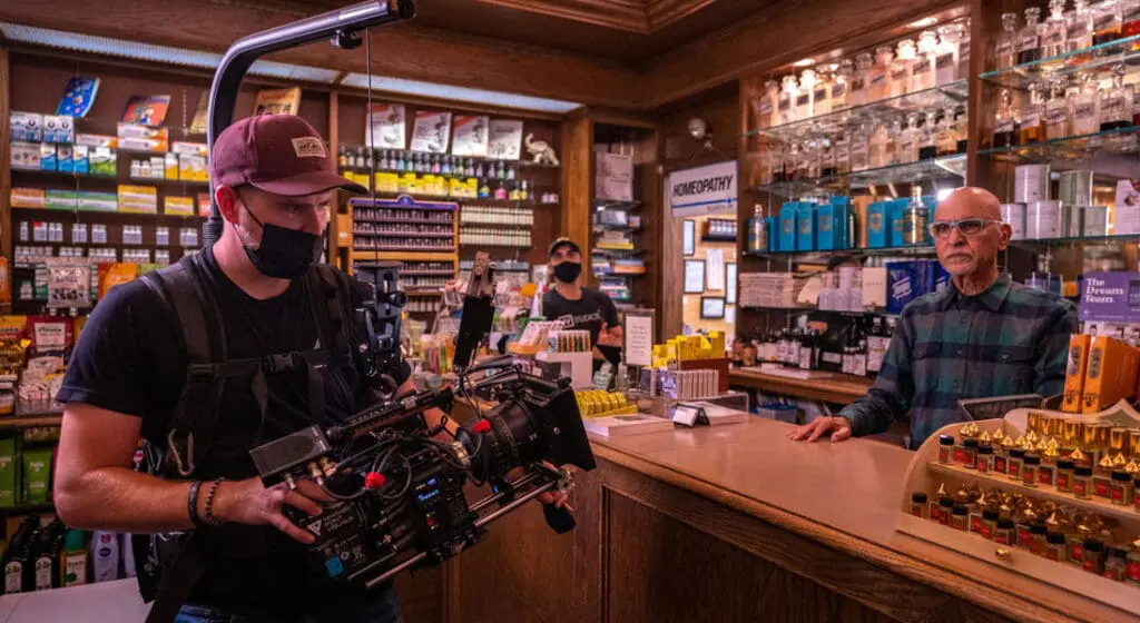 jv studio crew member filming the counter at merz apothecary