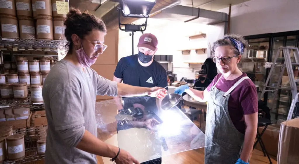 jv studios crew & merz apothecary employee setting up a shot