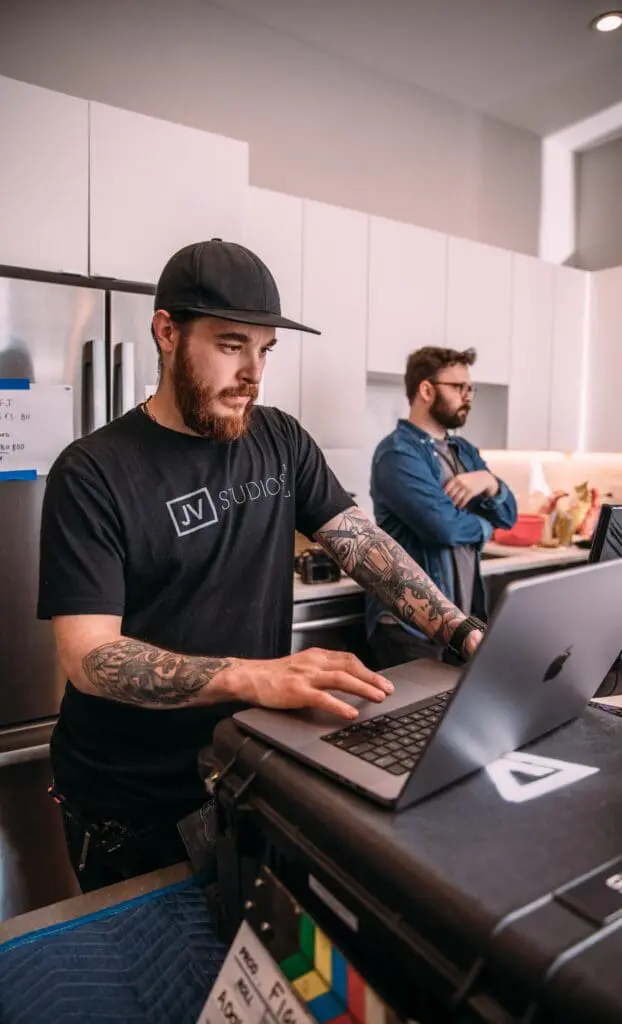 man typing on computer