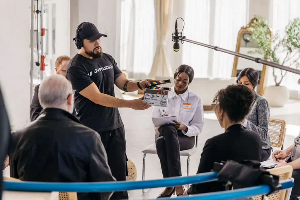 jv studios crew member holding a clapboard
