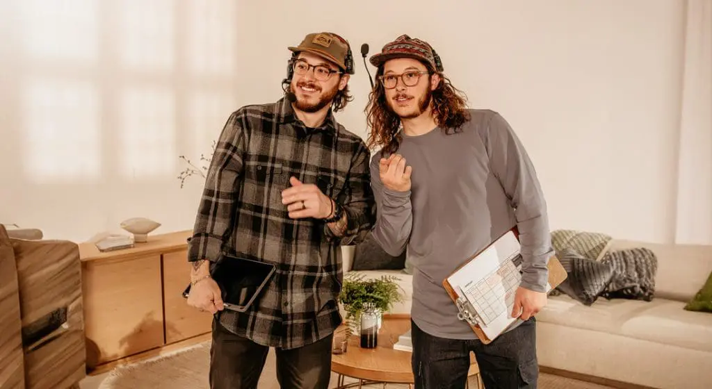 the two founders of jv studios viewing scripts for a video shoot