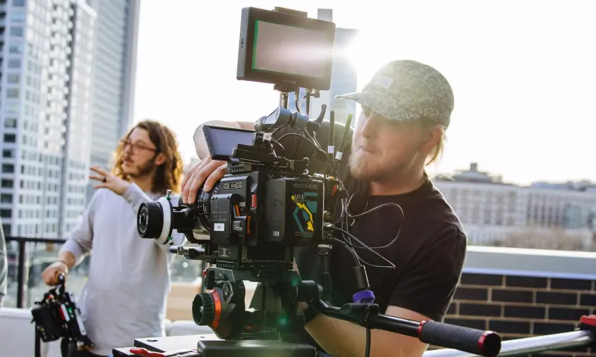 JV Studios employee operating a video camera