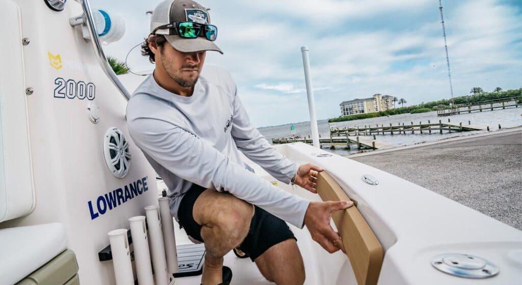 actor placing seadek padding on a boat