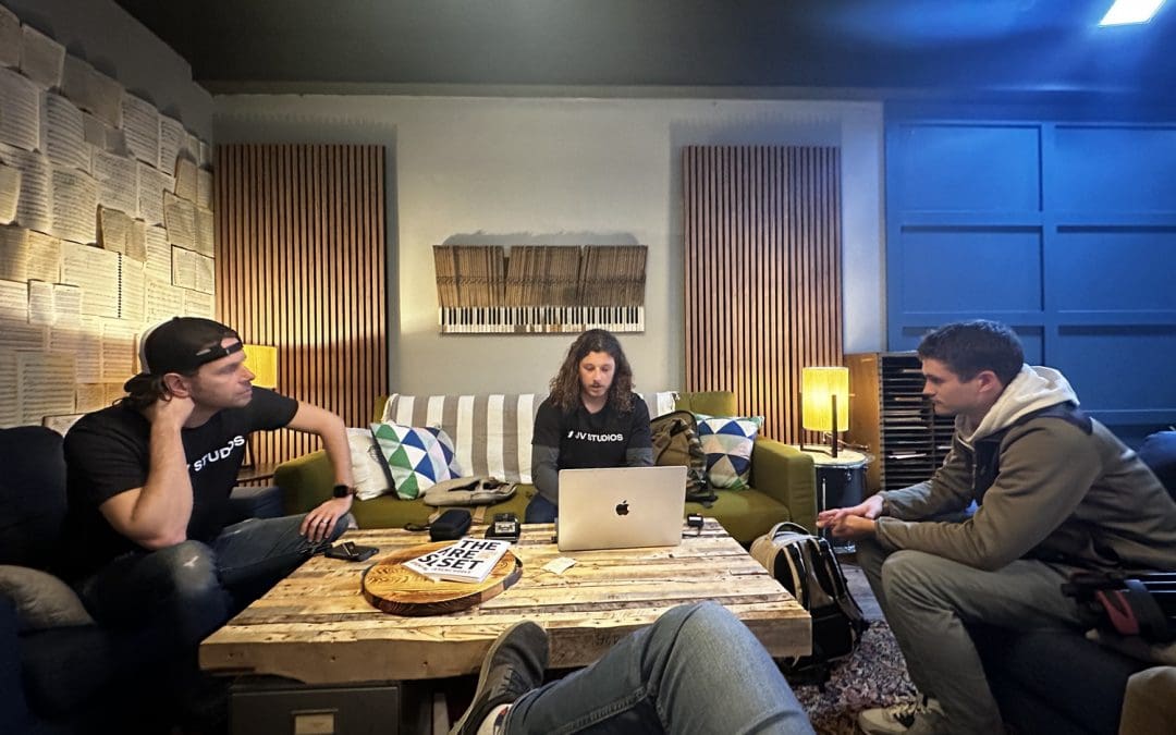 four creatives sitting around a table talking about a script