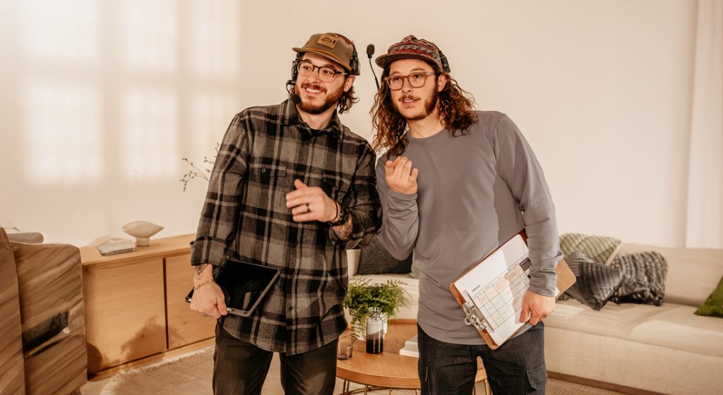 the two founders of jv studios viewing scripts for a video shoot