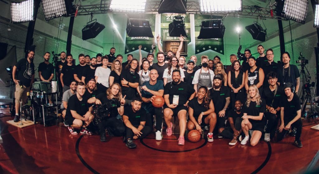 entire jv studios team posing for a team photo with alex caruso at a video shoot